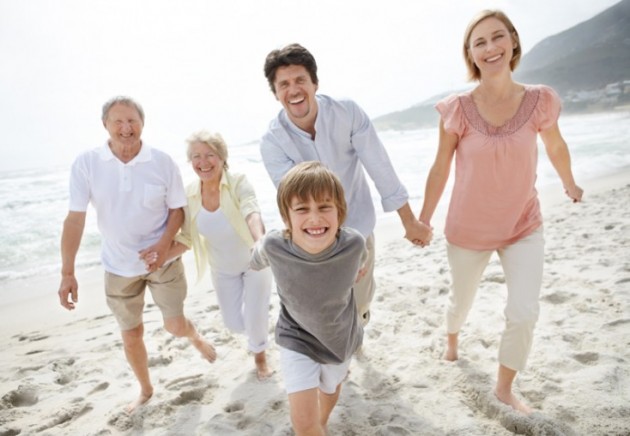 Happy family walking on the beach - Outdoor © Yuri Arcurs #7707022